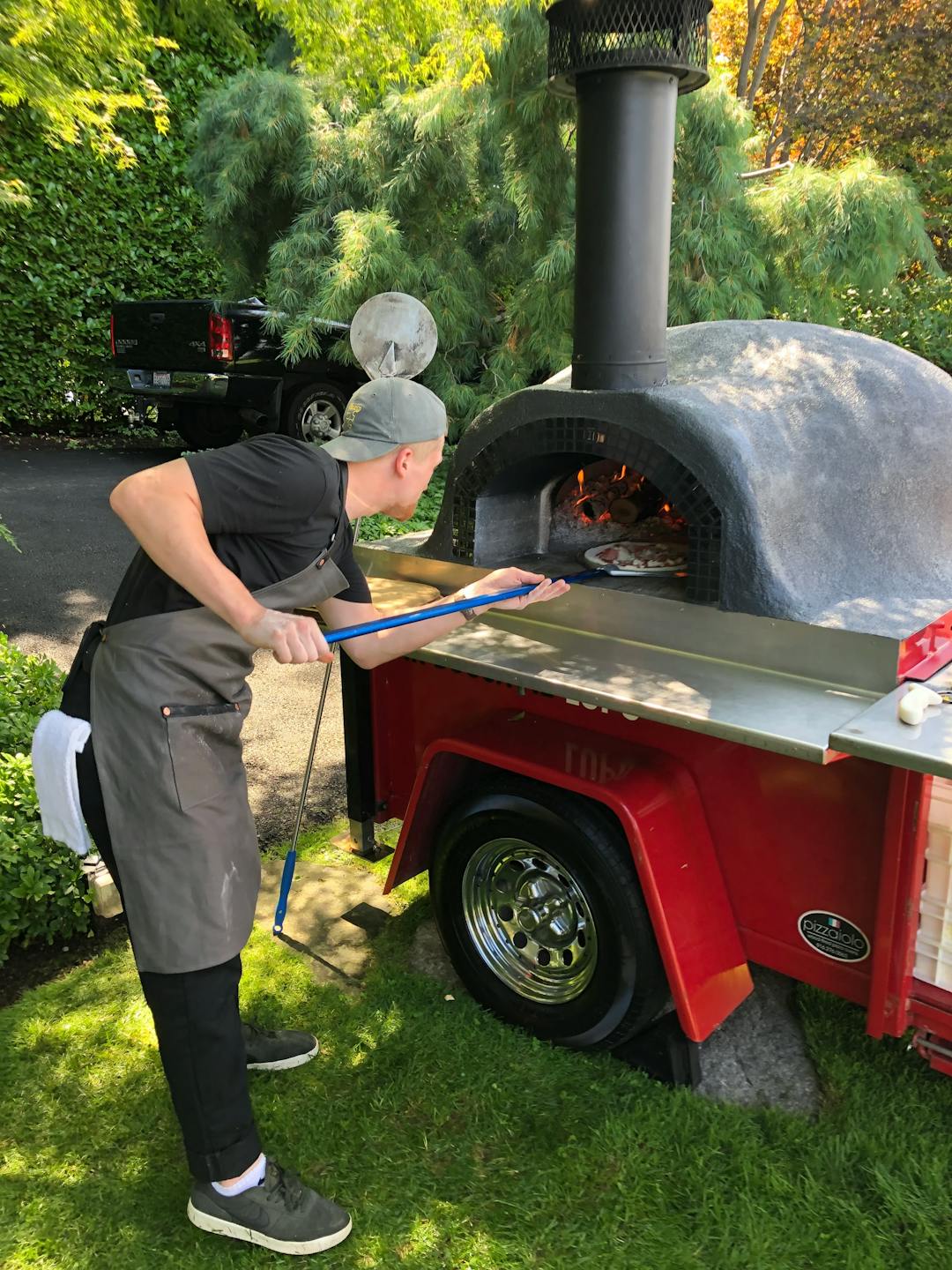 Photo of chef cooking pizza